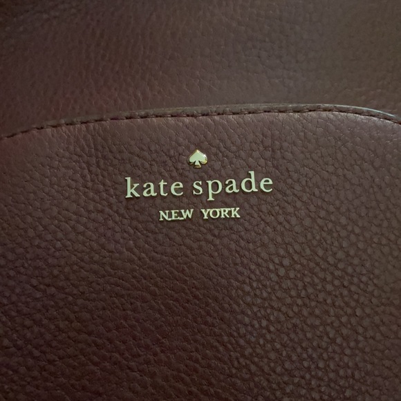Selling a maroon Kate spade purse/backpack (: